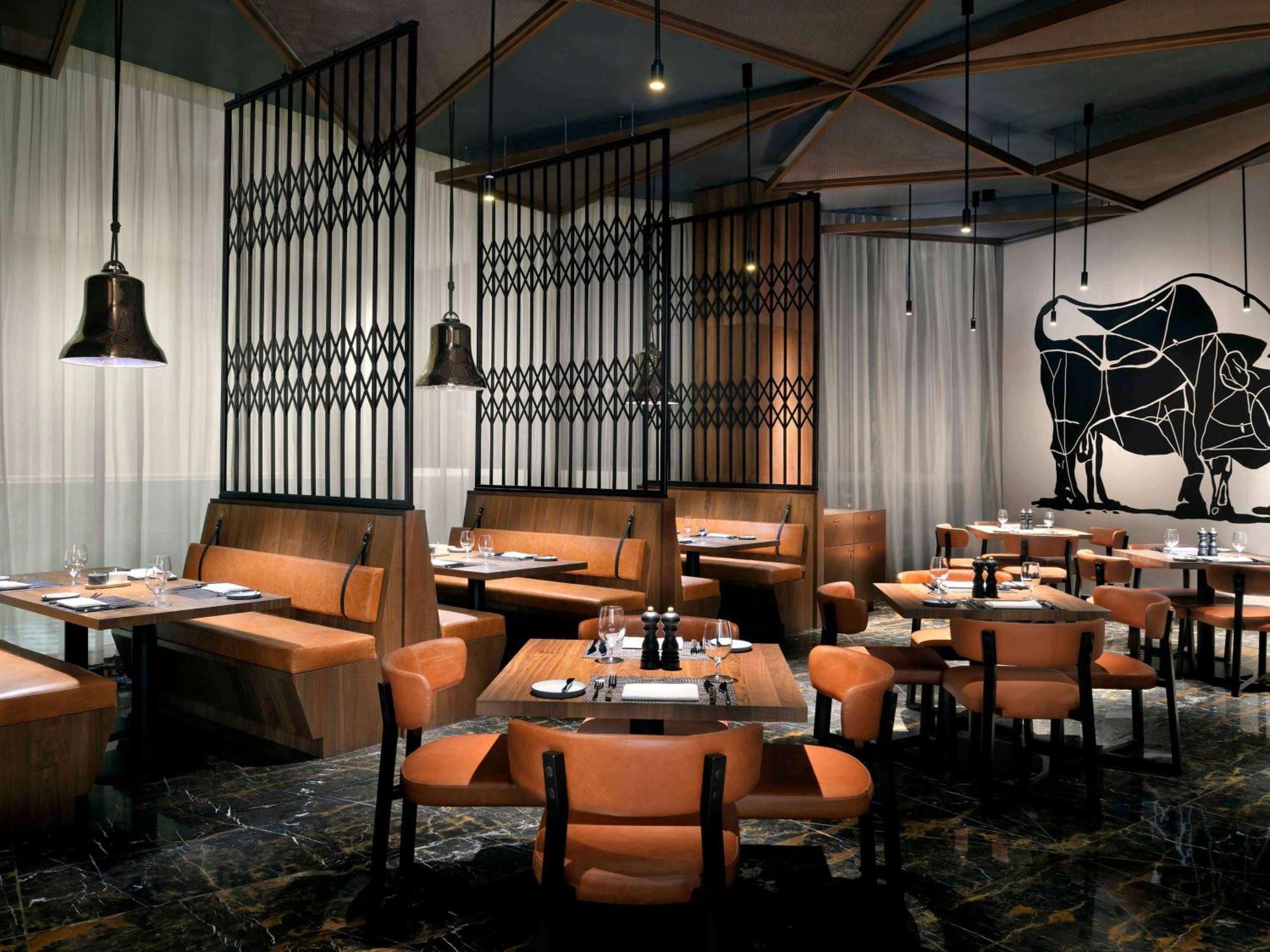 Moevenpick Hotel & Apartments Ghala Muscat Exterior photo The interior of a typical restaurant