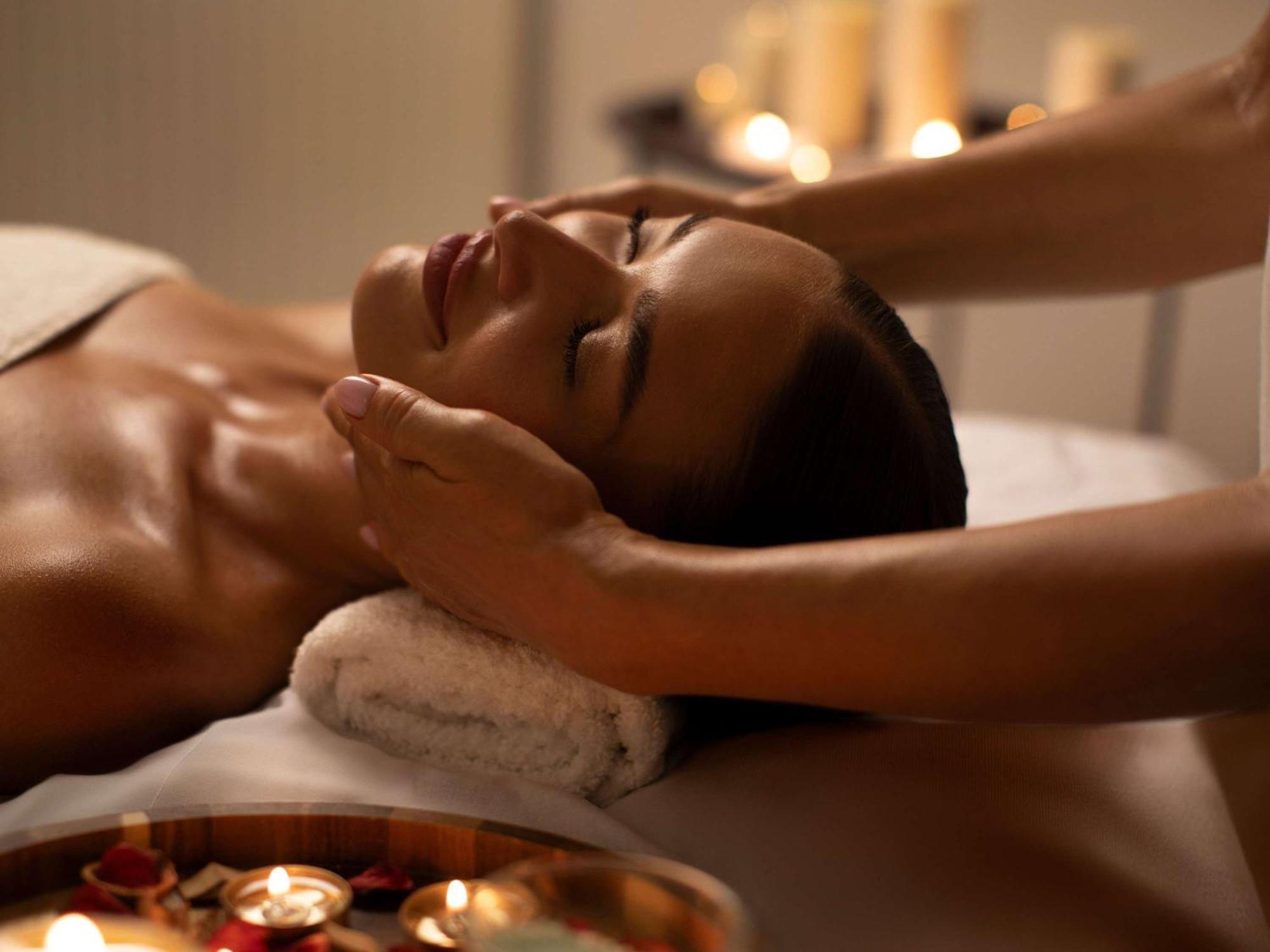 Moevenpick Hotel & Apartments Ghala Muscat Exterior photo A woman receiving a facial massage