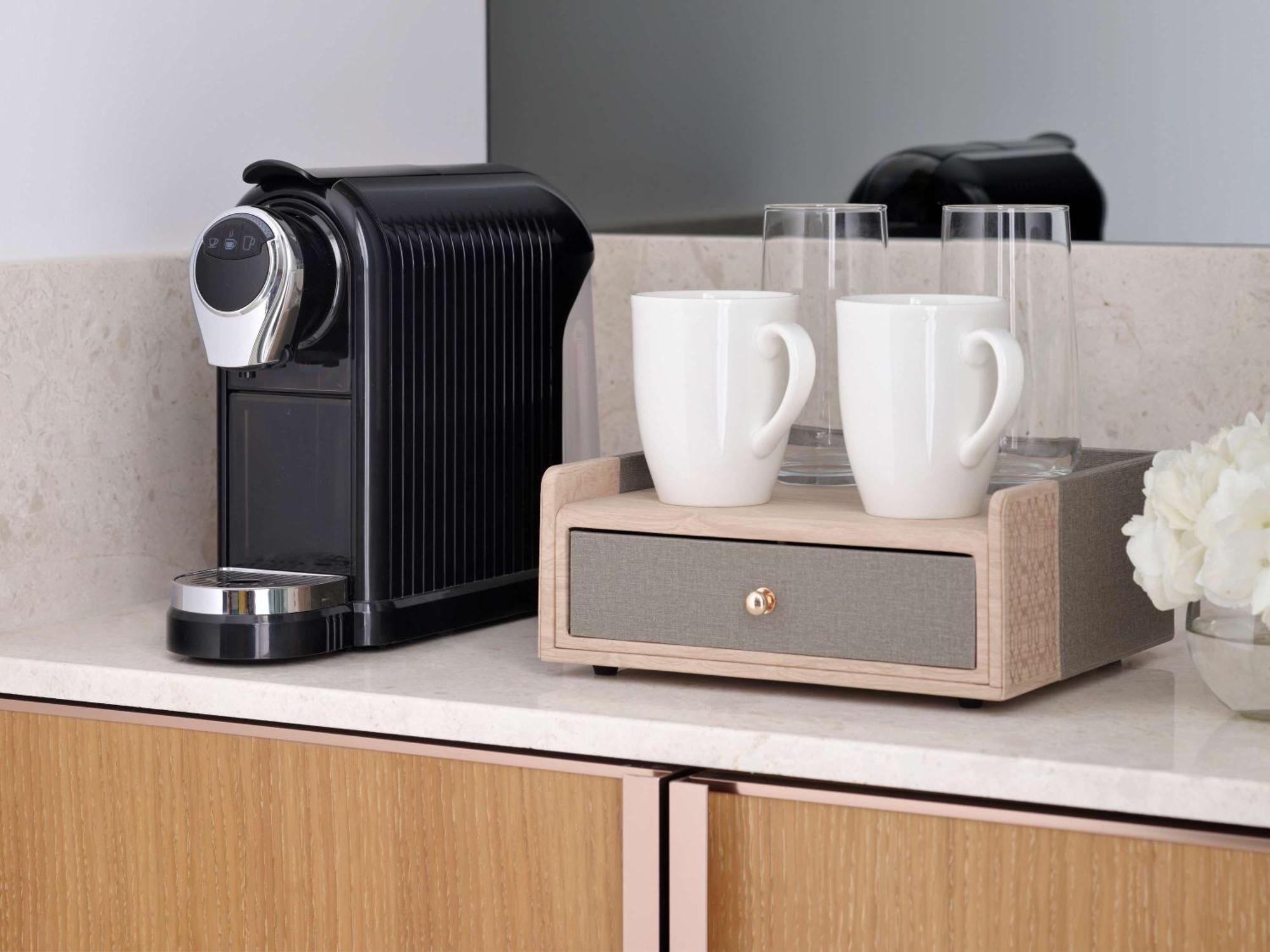 Moevenpick Hotel & Apartments Ghala Muscat Exterior photo A Nespresso coffee machine