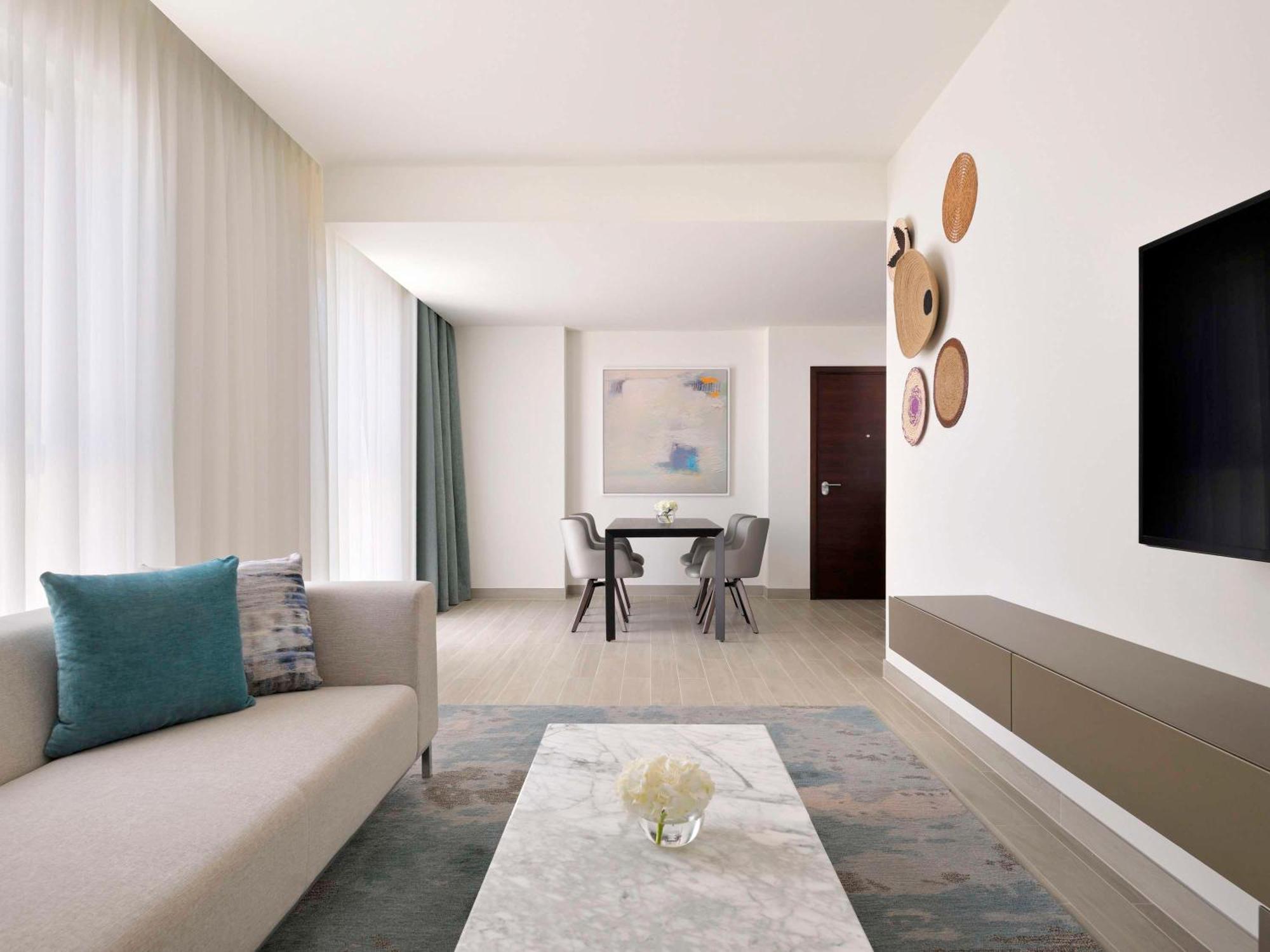 Moevenpick Hotel & Apartments Ghala Muscat Exterior photo A living room at the hotel